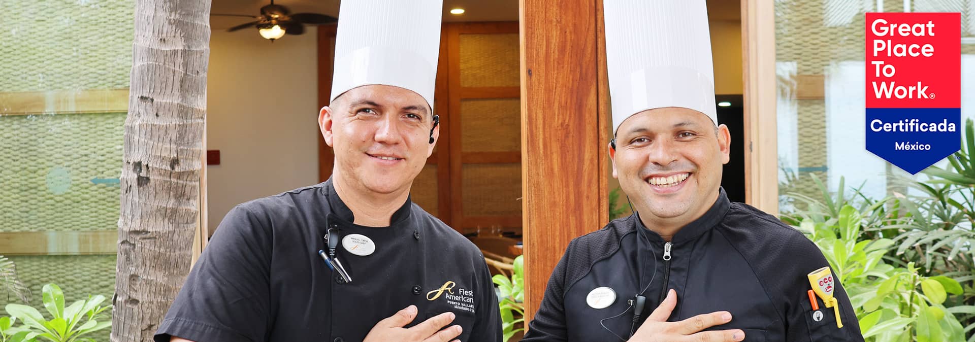 Two smiling chefs in black uniforms and tall white hats stand outdoors with one hand over their chest at one of the top conference events resorts. A Great Place to Work Certificada México badge is displayed on the right side of the image.