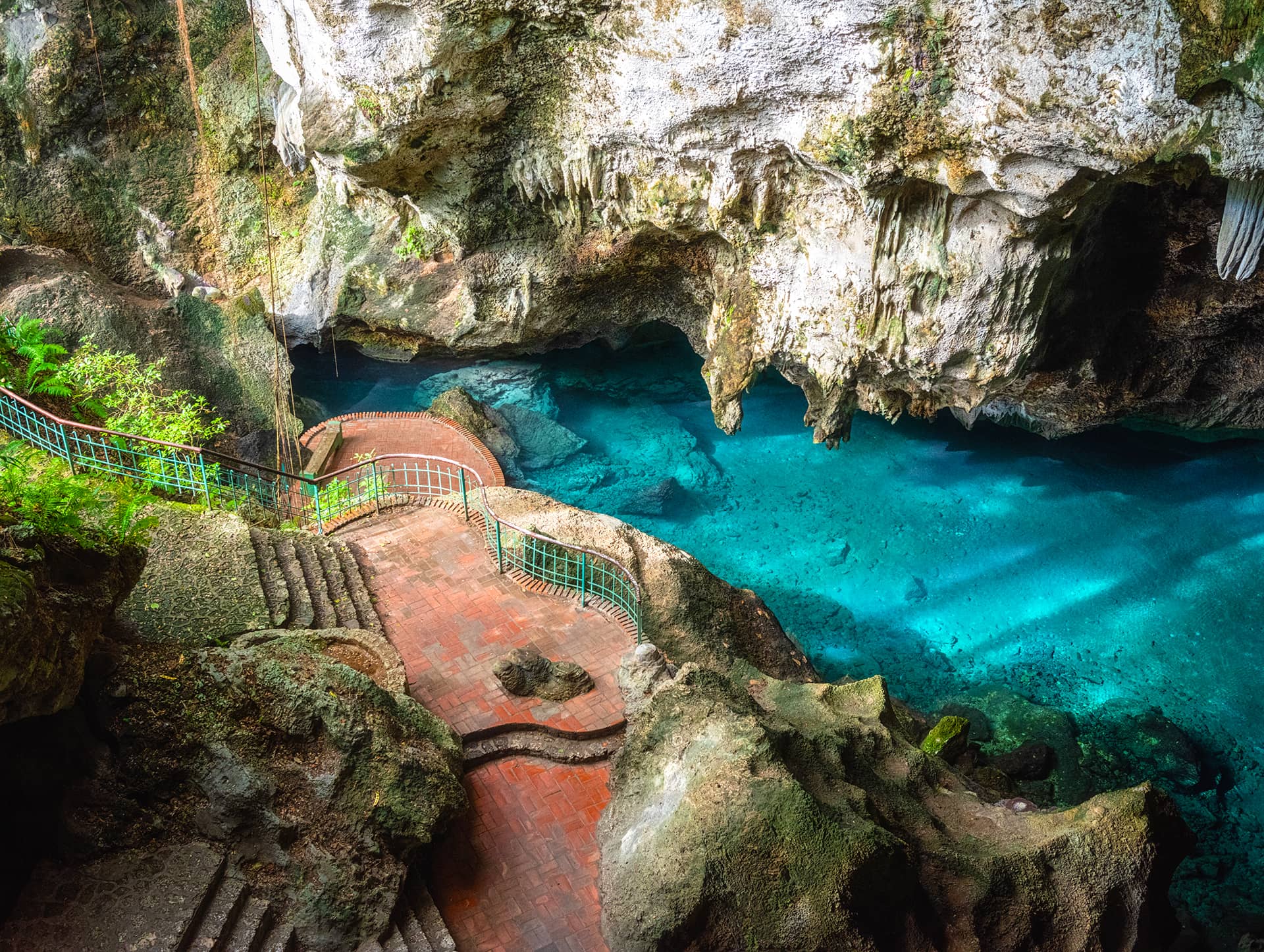 Three eyes cave in Santo Domingo, los Tres Ojos national park, Dominican Republic. Scenic view of limestone cave and crystal clear azure water of underground lake, nature landscape, travel background