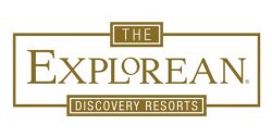 Logo for The Explorean Discovery Resorts, featuring the name in large gold letters with rectangular borders and smaller boxes above and below containing THE and DISCOVERY RESORTS—ideal for Mexico hotels, meetings, and conference events.
